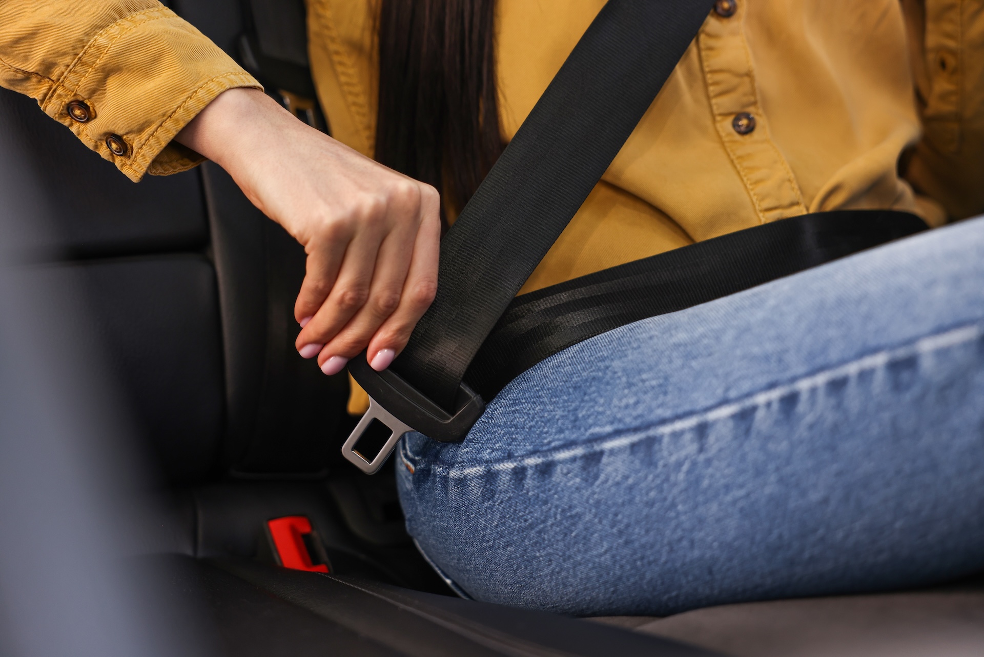 Woman Fastening Seat Belt
