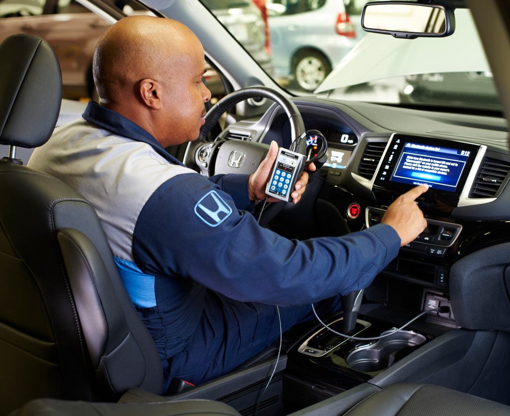 Honda vehicle at Honda of Salisbury service lane for inspection